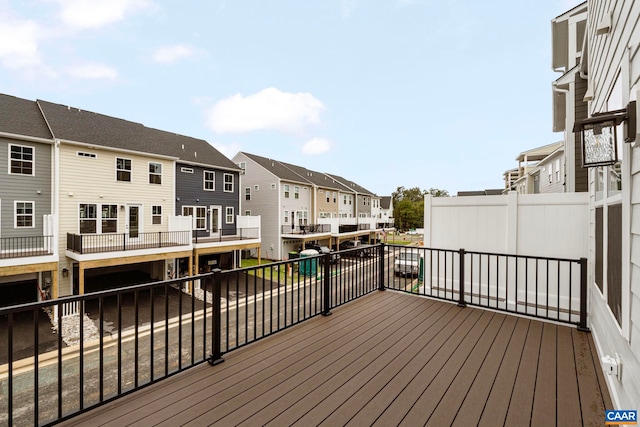 wooden deck featuring a residential view