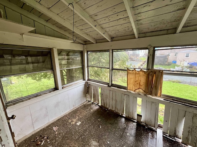 unfurnished sunroom with wooden ceiling and lofted ceiling with beams