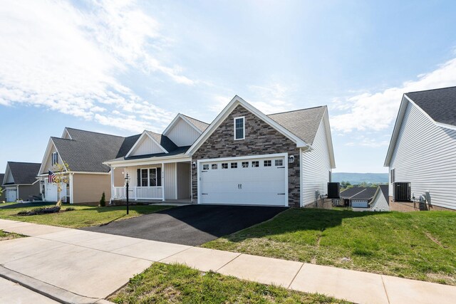 216 Spring Run Ln, Waynesboro, VA 22980 - view of front of home with asphalt driveway, central AC, a front yard, board and batten siding, and a garage