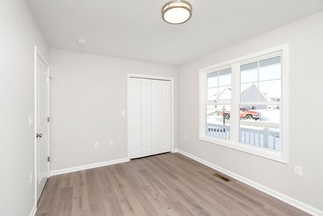 216 Spring Run Ln, Waynesboro, VA 22980 - unfurnished bedroom featuring light wood-type flooring, baseboards, and a closet