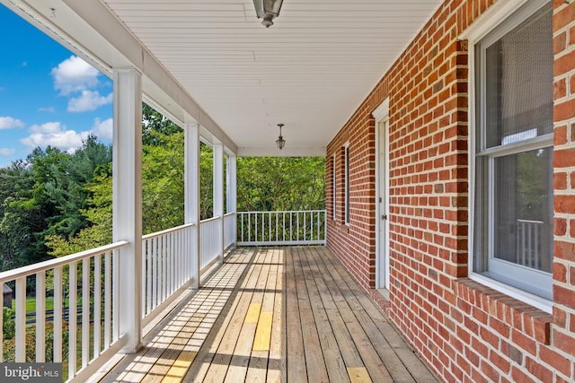 wooden terrace featuring a porch