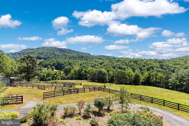 mountain view featuring a rural view and a wooded view