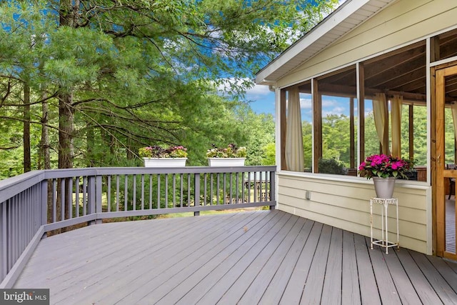 wooden terrace with a sunroom