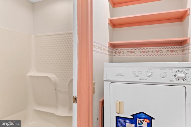 laundry room featuring laundry area and washer / clothes dryer