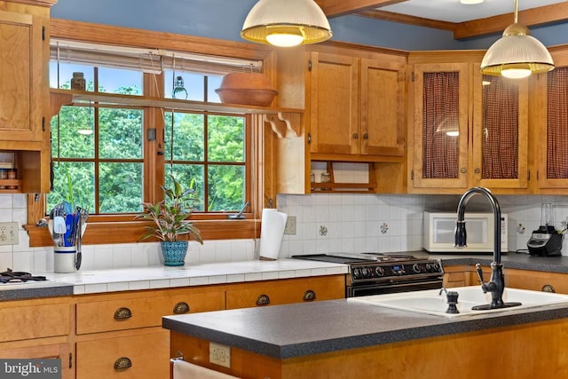 kitchen with electric range, brown cabinetry, glass insert cabinets, hanging light fixtures, and backsplash