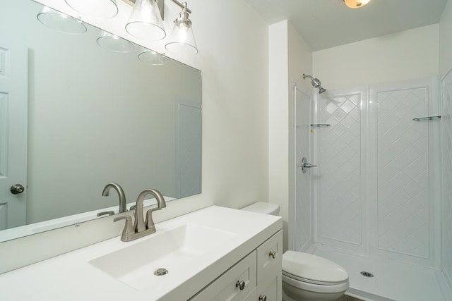 1014 Paul St, Harrisonburg, VA 22802 - bathroom featuring toilet, vanity, and a shower