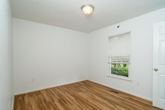 1014 Paul St, Harrisonburg, VA 22802 - empty room featuring wood finished floors and baseboards