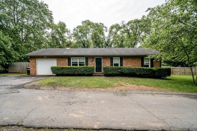 1014 Paul St, Harrisonburg, VA 22802 - ranch-style home with an attached garage, brick siding, driveway, and a chimney