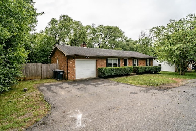 1014 Paul St, Harrisonburg, VA 22802 - single story home with a garage, brick siding, asphalt driveway, and a chimney
