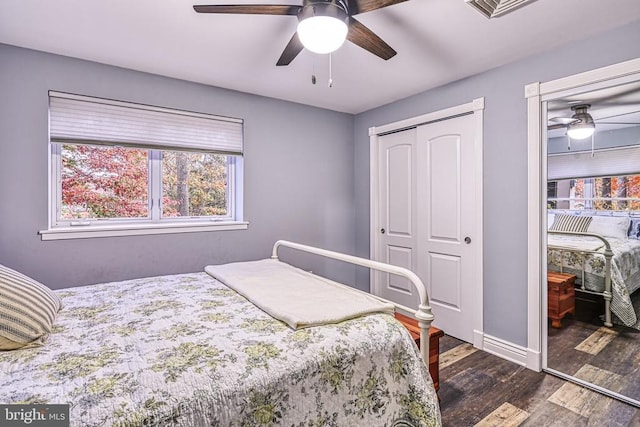 129 Lois Ln, Mineral, VA 23117 - bedroom featuring dark wood-type flooring, a closet, baseboards, and a ceiling fan