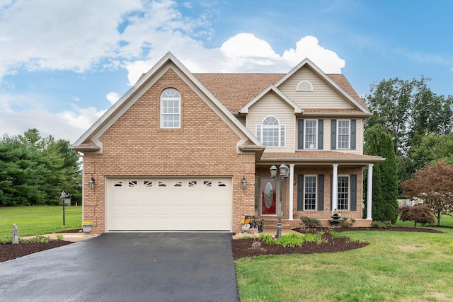 116 Buckingham Pl, Waynesboro, VA 22980 - traditional-style home with driveway, a front yard, brick siding, and a garage