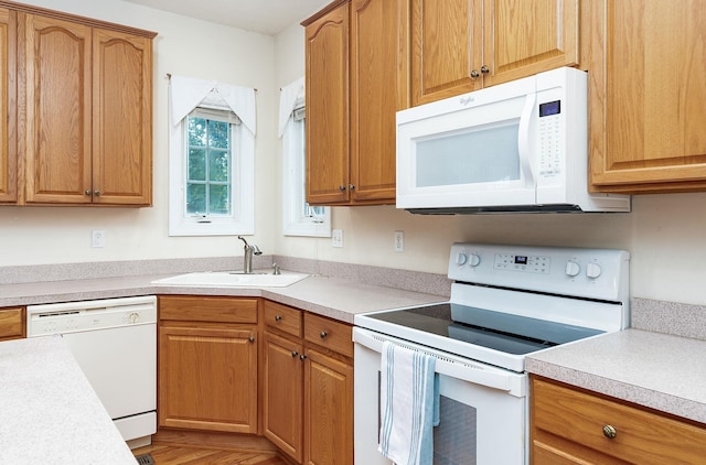 116 Buckingham Pl, Waynesboro, VA 22980 - kitchen with white appliances, a sink, light countertops, and brown cabinetry