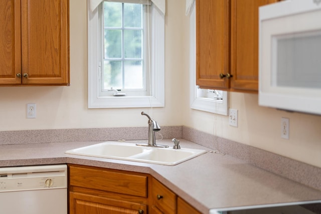 116 Buckingham Pl, Waynesboro, VA 22980 - kitchen with white appliances, a sink, brown cabinets, and light countertops