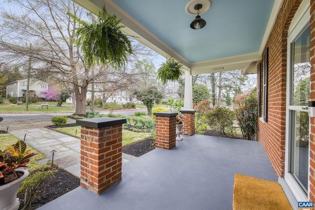 view of patio featuring a porch