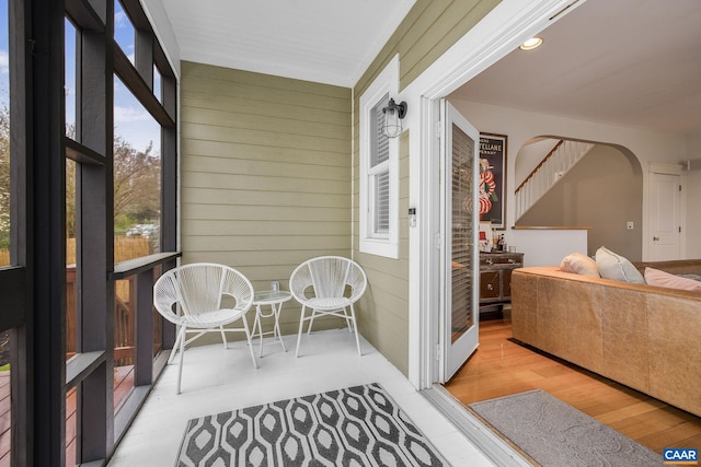 sunroom featuring arched walkways