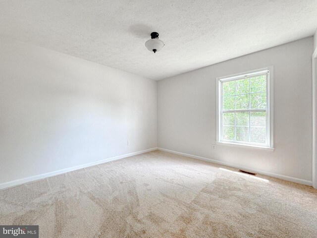 4110 Englandtown Rd, Fredericksburg, VA 22408 - carpeted spare room with baseboards and a textured ceiling