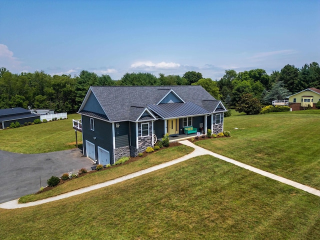 56 Serendipity Ln, Crimora, VA 24431 - view of front of property featuring covered porch, a garage, stone siding, driveway, and a front yard