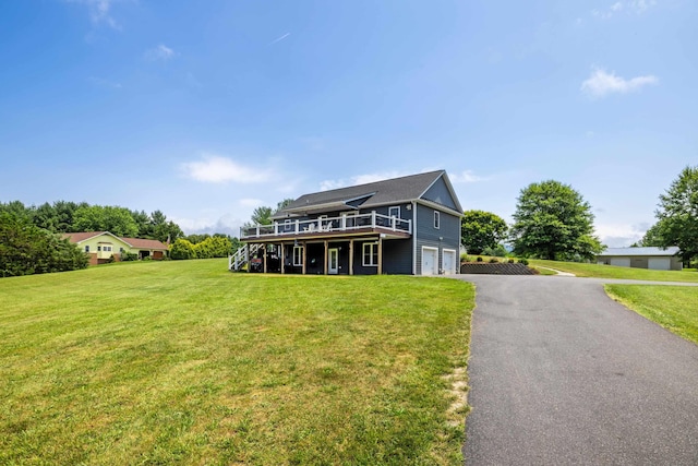 56 Serendipity Ln, Crimora, VA 24431 - view of front of property with a wooden deck, a garage, a front lawn, and driveway