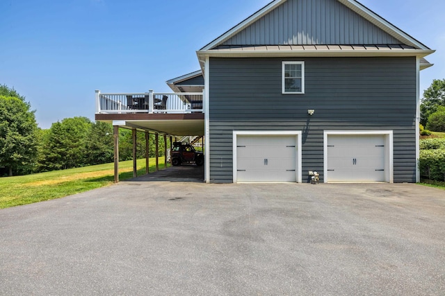 56 Serendipity Ln, Crimora, VA 24431 - view of side of property featuring board and batten siding, a standing seam roof, a wooden deck, a garage, and a metal roof