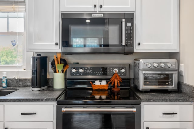 56 Serendipity Ln, Crimora, VA 24431 - kitchen featuring stainless steel range with electric cooktop, healthy amount of natural light, and dark countertops