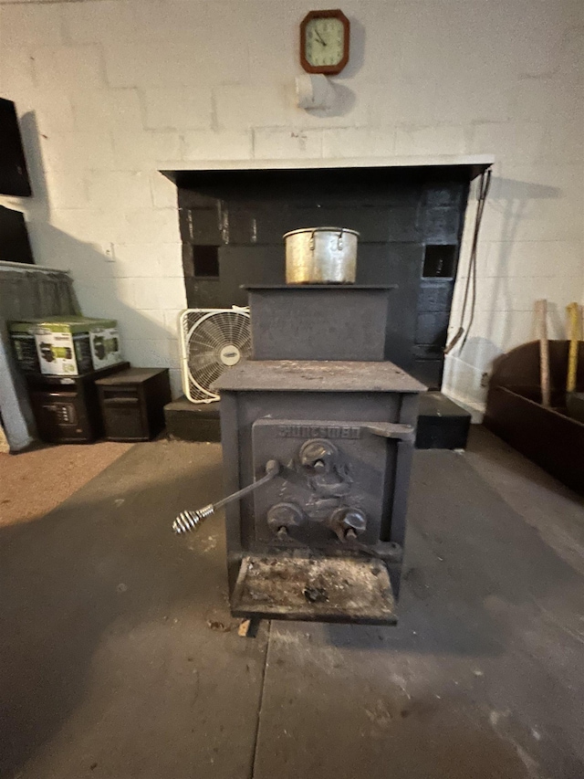 847 Bear Wallow Flat Ln, Deerfield, VA 24431 - detailed view of a wood stove and concrete block wall