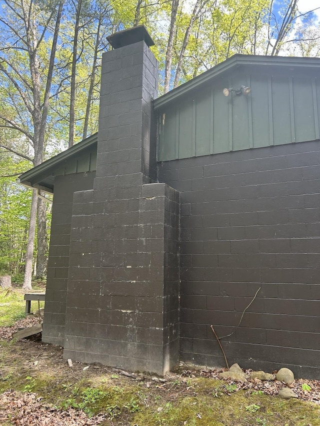847 Bear Wallow Flat Ln, Deerfield, VA 24431 - view of property exterior featuring a chimney, board and batten siding, and concrete block siding