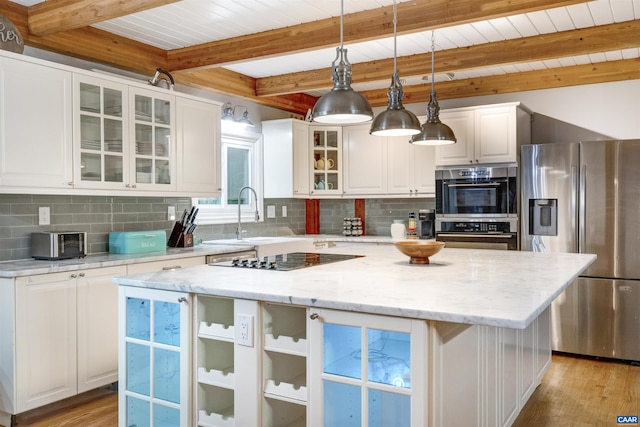 6406 Carter Ln, Mineral, VA 23117 - kitchen featuring stainless steel appliances, a sink, light wood-style floors, a kitchen island, and beam ceiling