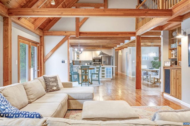 6406 Carter Ln, Mineral, VA 23117 - living area featuring beam ceiling, light wood-style flooring, baseboards, wooden ceiling, and high vaulted ceiling
