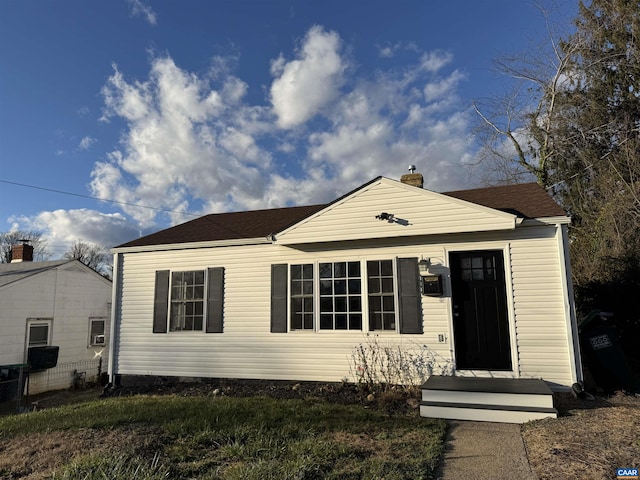 view of front of home with a chimney