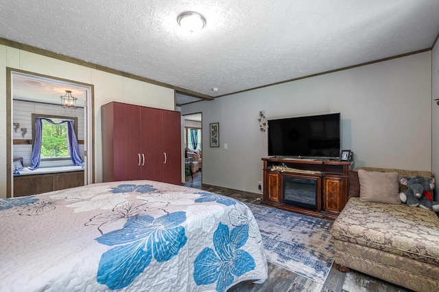 2749 Lee Hwy E, New Market, VA 22844 - bedroom with crown molding, a textured ceiling, and wood finished floors