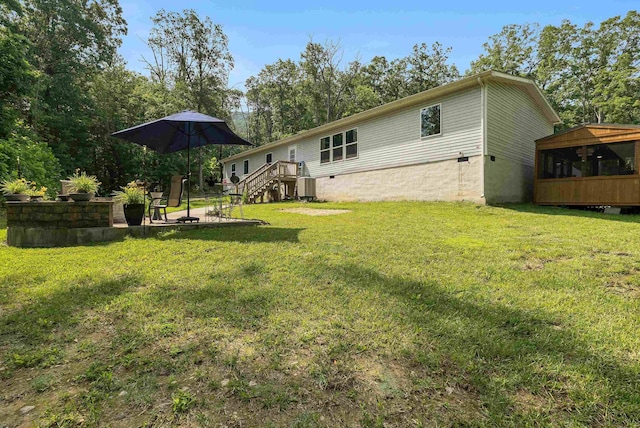 2749 Lee Hwy E, New Market, VA 22844 - rear view of property featuring a yard and a patio area
