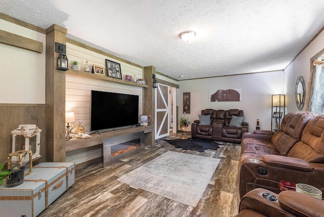 2749 Lee Hwy E, New Market, VA 22844 - living area with a textured ceiling, wood finished floors, a barn door, and wooden walls