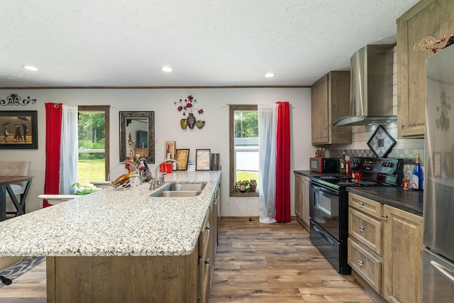 2749 Lee Hwy E, New Market, VA 22844 - kitchen featuring black appliances, wall chimney range hood, a peninsula, a textured ceiling, and wood finished floors
