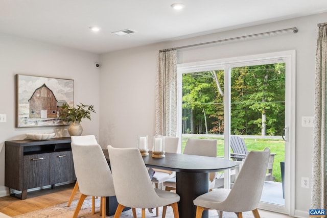 dining room featuring recessed lighting, visible vents, and light wood-style floors