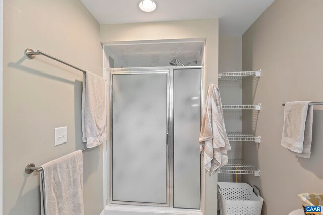 bathroom with a shower stall