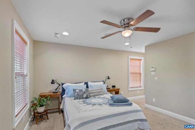 bedroom with light colored carpet, baseboards, ceiling fan, and recessed lighting