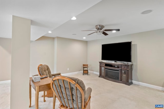 sitting room with ceiling fan, carpet floors, baseboards, recessed lighting, and a fireplace