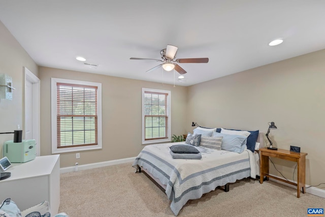 bedroom featuring light colored carpet, baseboards, ceiling fan, and recessed lighting