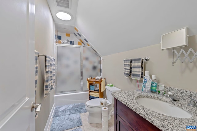 bathroom with bath / shower combo with glass door, toilet, vanity, tile patterned floors, and vaulted ceiling