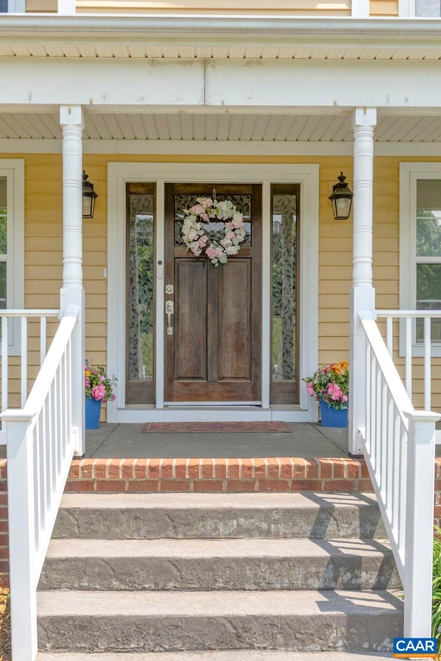 property entrance featuring covered porch