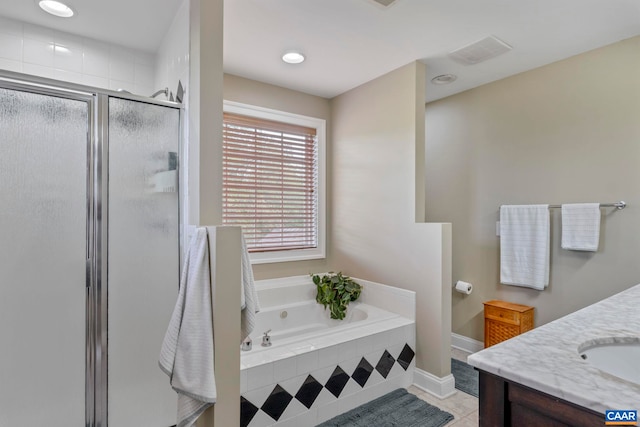 full bath featuring a shower stall, a bath, vanity, tile patterned floors, and baseboards