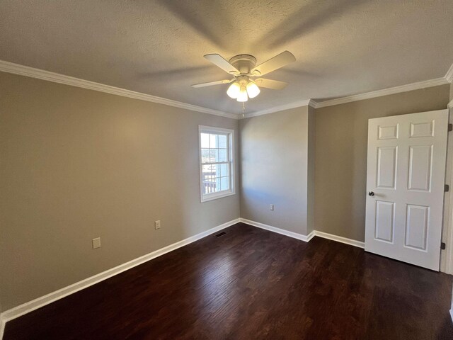 spare room featuring ceiling fan, ornamental molding, dark hardwood / wood-style flooring, and a textured ceiling