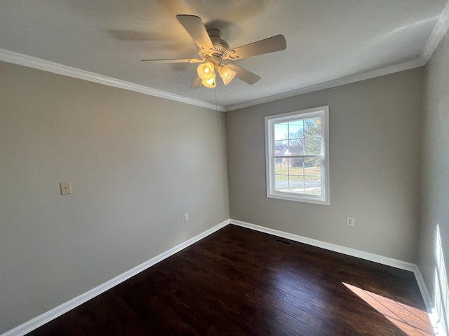 spare room with ceiling fan, ornamental molding, and dark hardwood / wood-style flooring