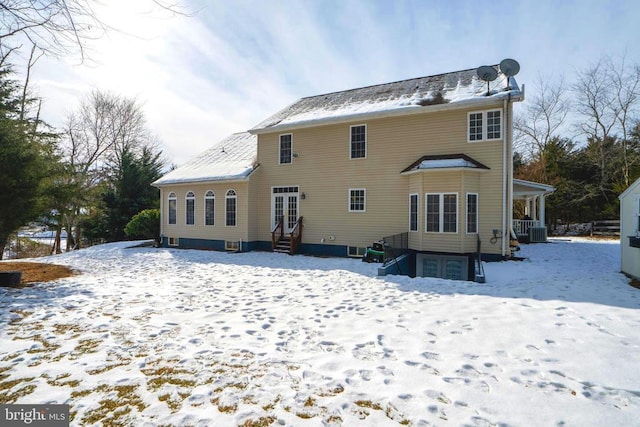 view of snow covered house