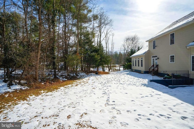 view of yard covered in snow