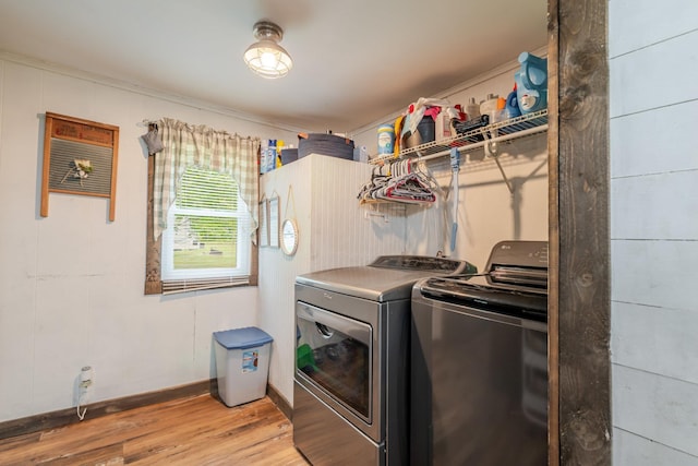 2420 Jollett Rd, Elkton, VA 22827 - laundry room featuring washer and clothes dryer, light wood-type flooring, baseboards, and crown molding