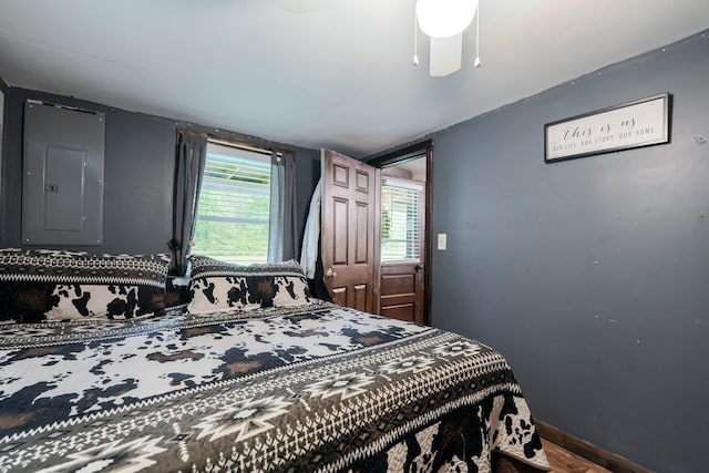 2420 Jollett Rd, Elkton, VA 22827 - bedroom featuring electric panel, multiple windows, wood finished floors, and ceiling fan