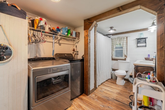 2420 Jollett Rd, Elkton, VA 22827 - washroom with separate washer and dryer, wood finished floors, wooden walls, and ceiling fan