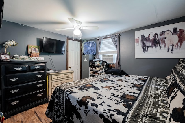 2420 Jollett Rd, Elkton, VA 22827 - bedroom with light wood finished floors, a ceiling fan, and cooling unit