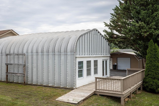 view of outbuilding with a lawn